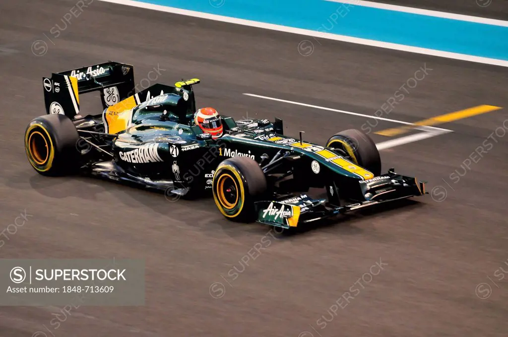 Formula One racing cars of Jarno Trulli, Italy, start number 21, of the Team Lotus-Renault on the Yas Marina Circuit race track on Yas Island during t...