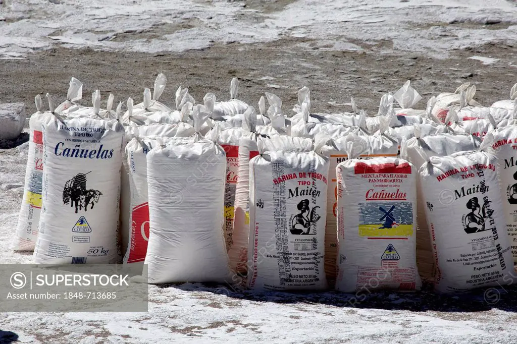 Salt, packed in flour bags, at a salt lake, Atacama Desert, Altiplano, southern Bolivia, South America