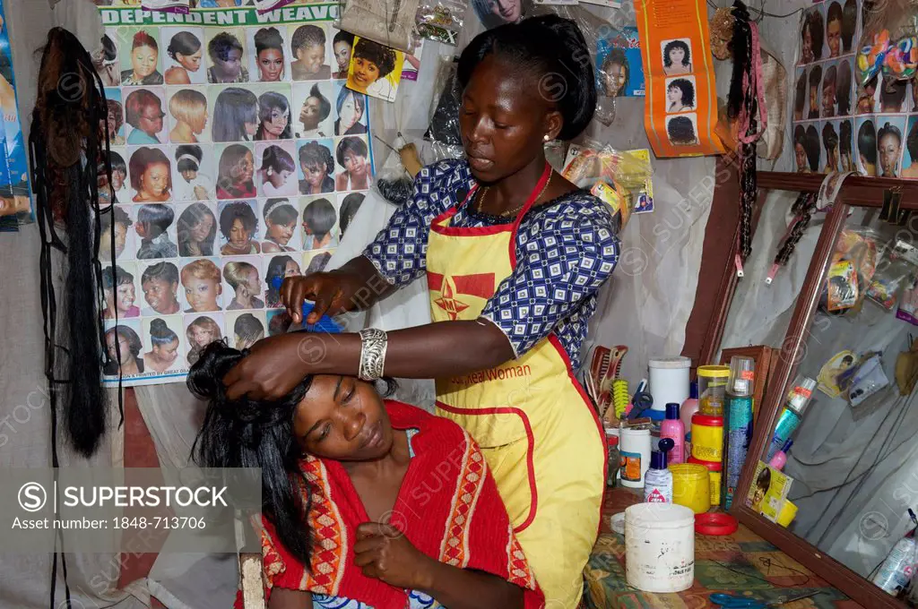 Female hairdresser and customer, hairdresser's shop, Bamenda, Cameroon, Africa