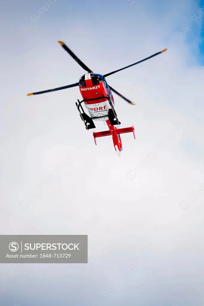 Rescue helicopter approaching, rescue operation with a rescue helicopter in the Thuringian Slate Mountains, Thuringia, Germany, Europe
