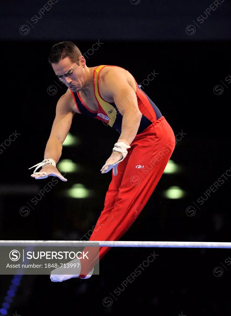 Rafael Martinez, ESP, performing on high bar, EnBW Gymnastics World Cup, 11 to 13 Nov 2011, 29th DTB Cup, Porsche-Arena, Stuttgart, Baden-Wuerttemberg...