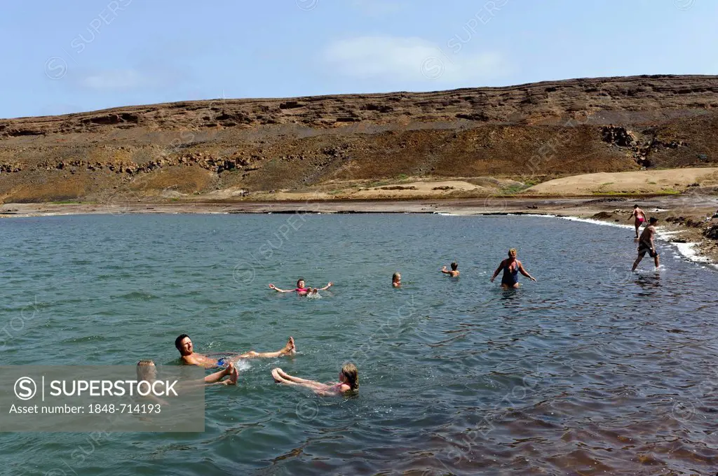 People in the sea, swimming, saltworks in the crater of Pedra de Lume, Sal, Cape Verde, Africa