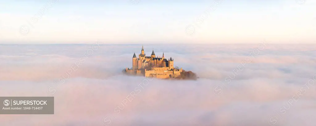 Burg Hohenzollern castle in morning light, mist, Schwaebische Alb, Swabian Alb, Baden-Wuerttemberg, Germany, Europe