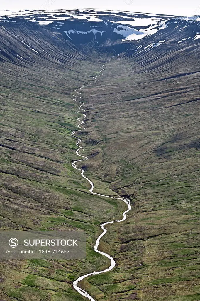 Aerial view, a meandering river flowing from the western highlands of Iceland through a valley towards the sea, Iceland, Europe