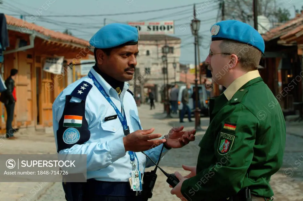 Indian, Kosovan and German police officers, international police patrol in the old town of Gjakova, the police operations are part of the United Natio...