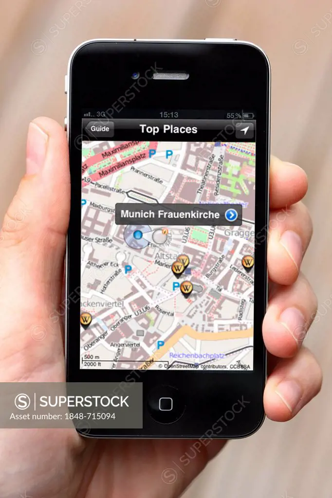 IPhone, smartphone, showing an app on the display with a town map and local information, also available offline