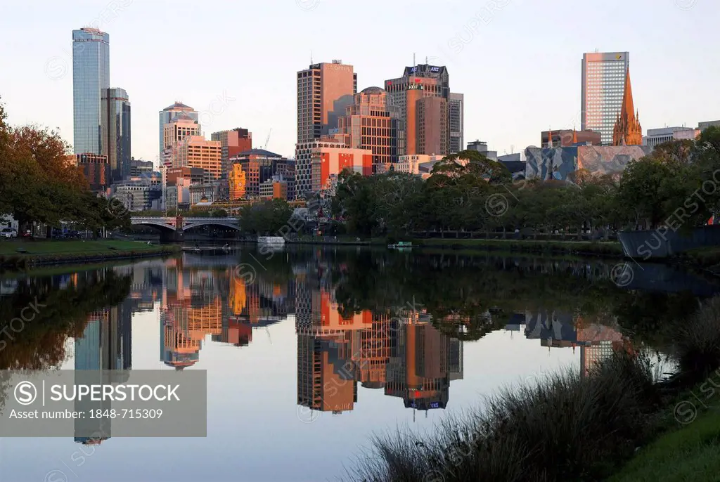 Skyline of Melbourne reflected in the Yarra River, Melbourne, Victoria, Australia