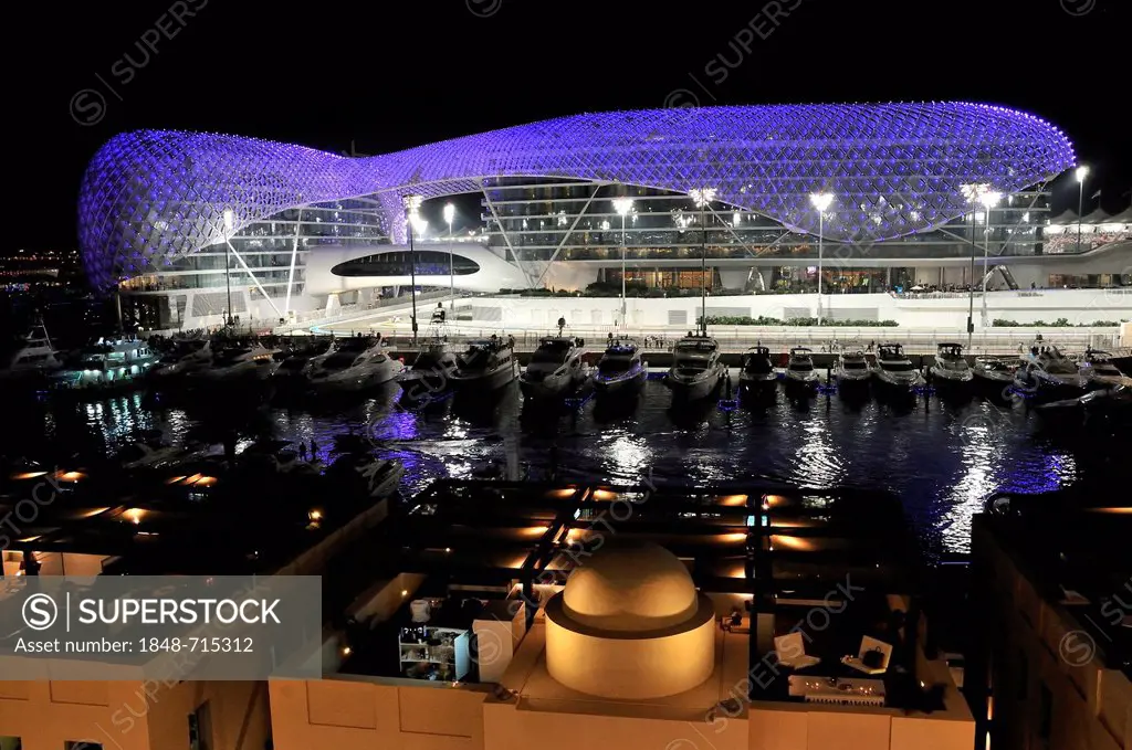 Yas Hotel and marina at the Formula One racetrack Yas Marina Circuit on Yas Island at night, Abu Dhabi, United Arab Emirates, Arabia, Asia