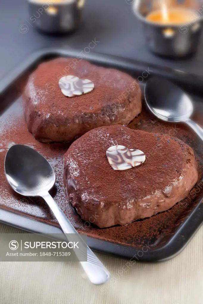 Two chocolate mousse desserts in heart shape