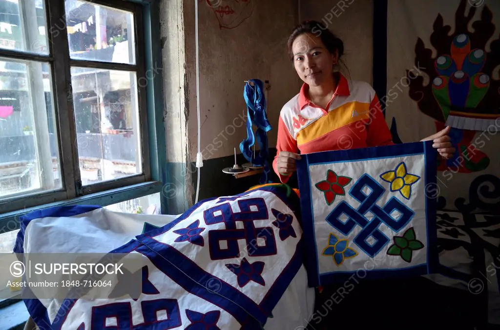 Tibetan handicrafts, dressmaker with Buddhist symbols on textiles, textile art, Tibet, Lhasa, China, Asia
