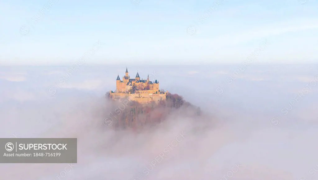 Burg Hohenzollern castle in morning light, early morning fog, Swabian Alb, Baden-Wuerttemberg, Germany, Europe