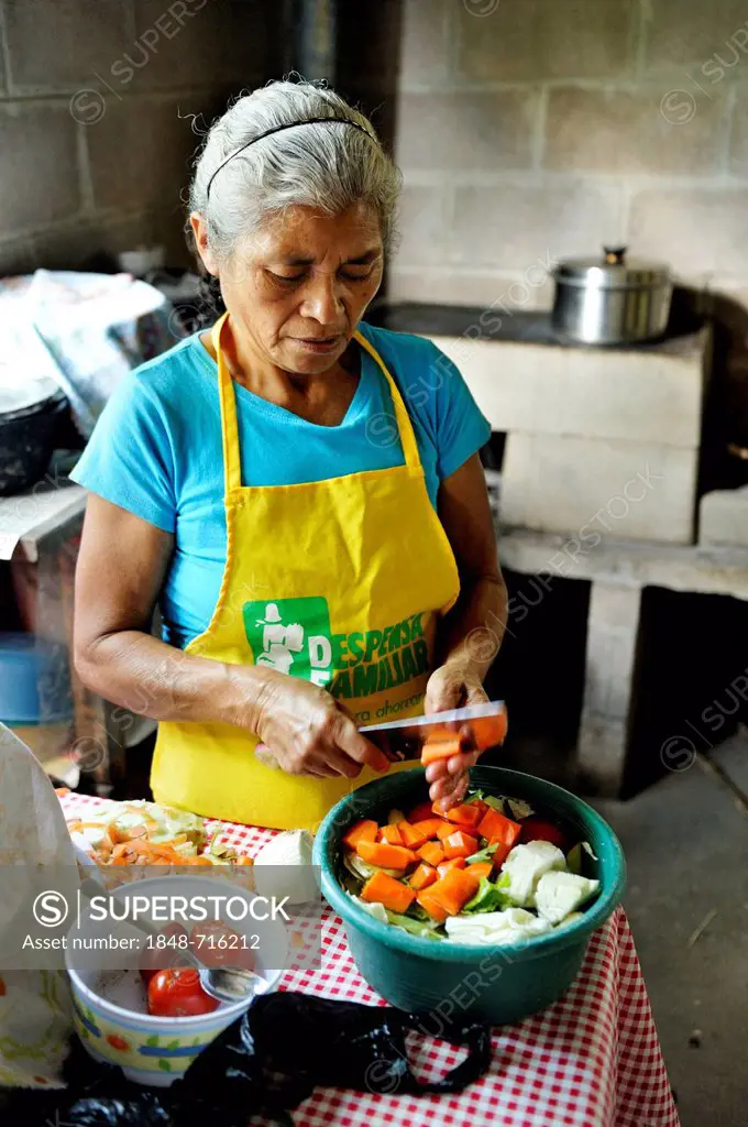 Female cook cutting vegetables for a soup, community of Cerro Verde, El Salvador, Central America, Latin America