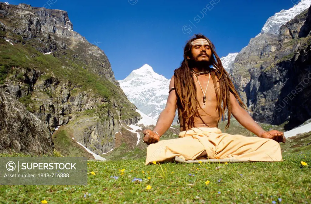 Shiva sadhu meditating next to his cave high above Badrinath, Uttarakhand, formerly Uttaranchal, India, Asia