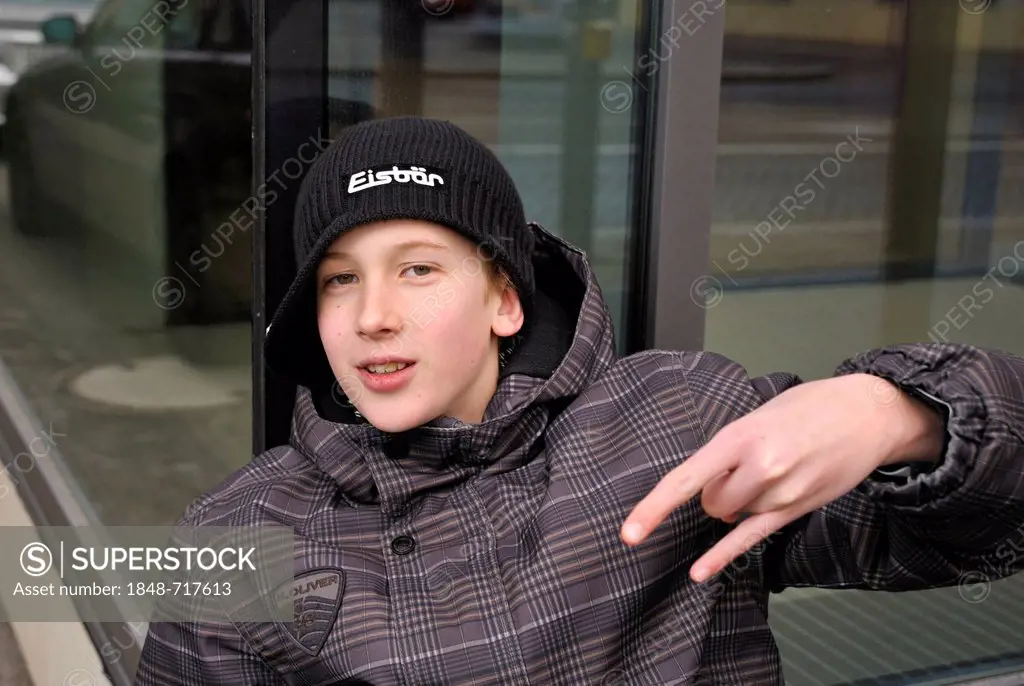 Boy, 12 or 13 years, cool hand gesture, PublicGround
