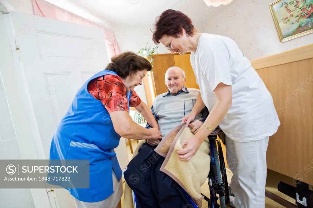 Outpatient care provided by the German Red Cross, nurse Anke Lehmann visits an elderly couple every morning to help the wife of dementia suffering hus...