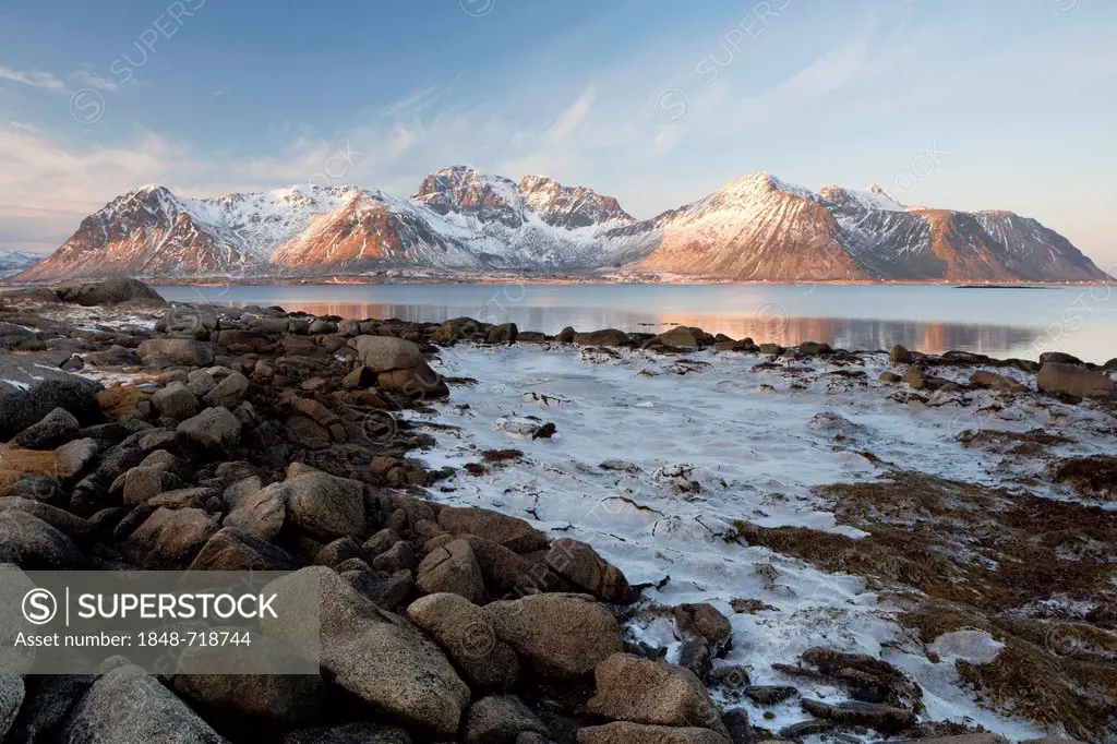 Ice and mountains in the Lofoten Islands in the winter light, Norway, Europe