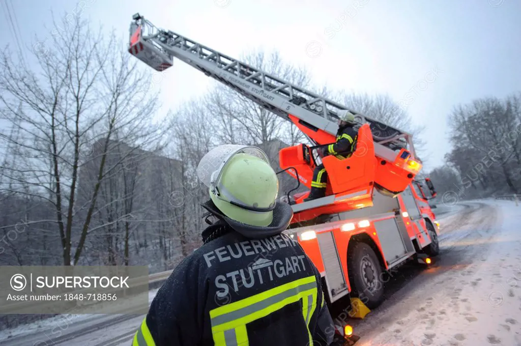 Ladder of the Stuttgart Fire Brigade illuminating an accident site on the Mittleren Filderstrasse road, Stuttgart, Baden-Wuerttemberg, Germany, Europe