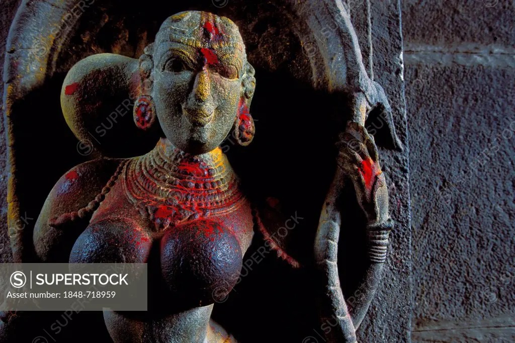 Women's sculpture decorated with kumkum powder, entrance of Minakshi, Meenakshi or Sri-Minakshi-Sundareshwara Temple, Madurai, Tamil Nadu, South India...