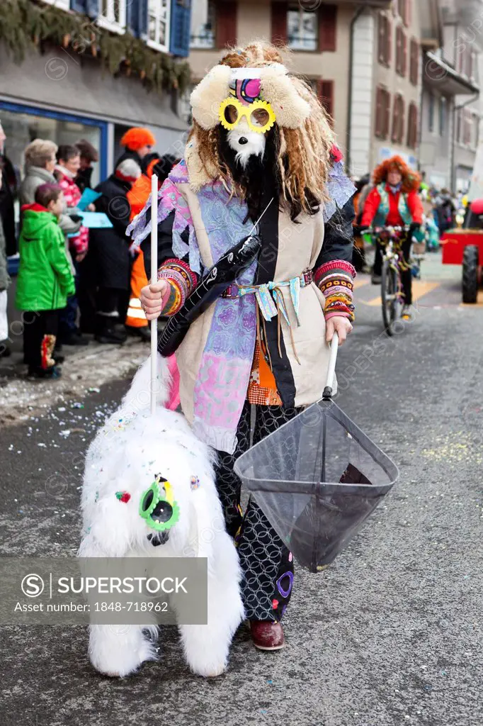 Dog breeder with a dog, costume, 35th Motteri-Umzug parade in Malters, Lucerne, Switzerland, Europe