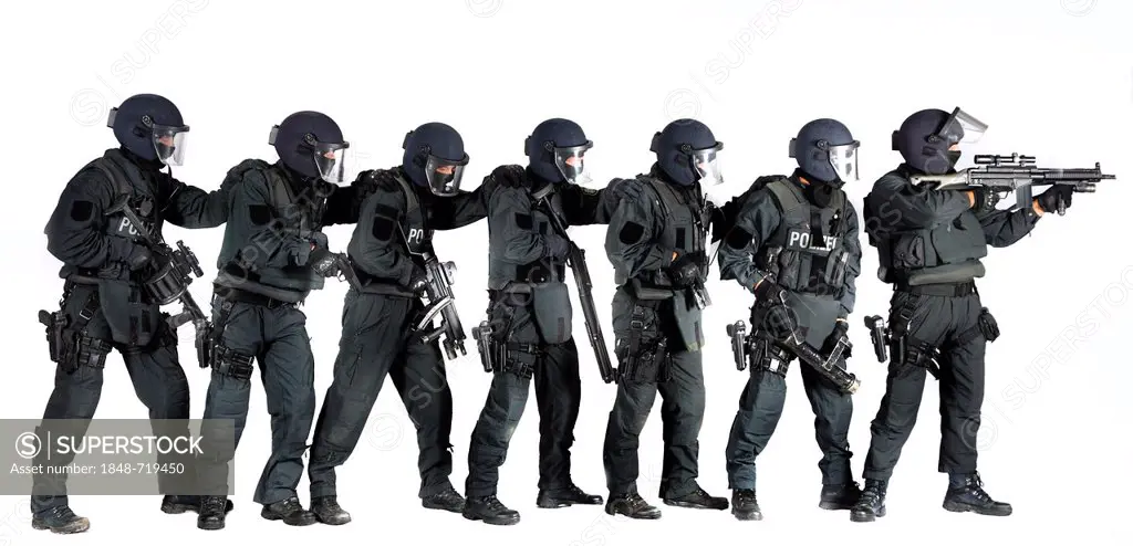 Police, Special Task Force, SEK, squad holding a metal battering ram and various weapons