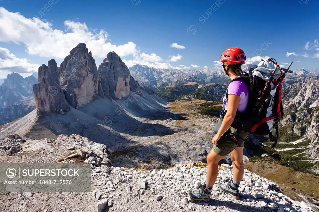 Climber on the Paternkofel Pass, facing the Tre Cime di Lavaredo or Three Peaks, with Monte Cristallo behind, Sesto, Alta Pusteria, Dolomites, Alto Ad...