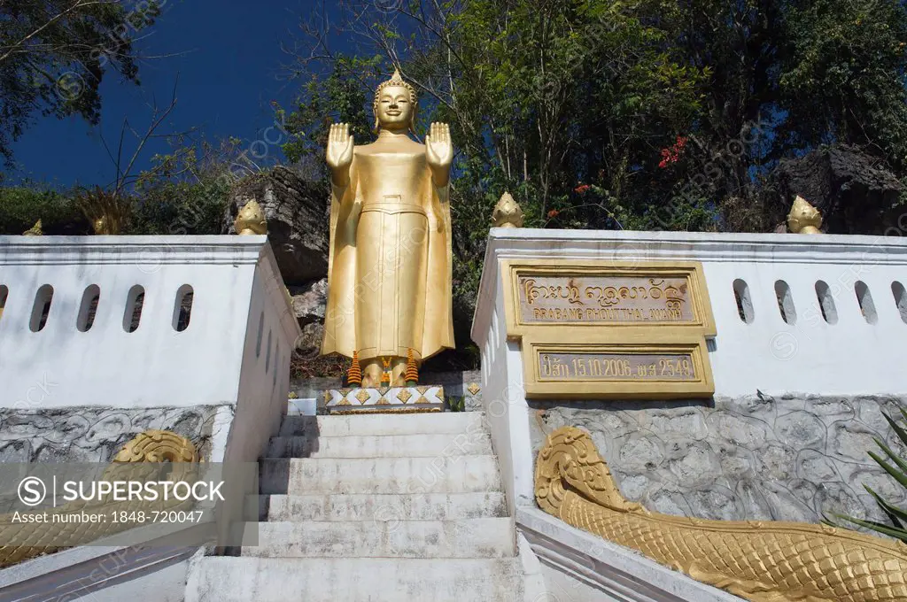 Standing Buddha statue at a temple on Phousi Mountain, Luang Prabang, Laos, Indochina, Asia