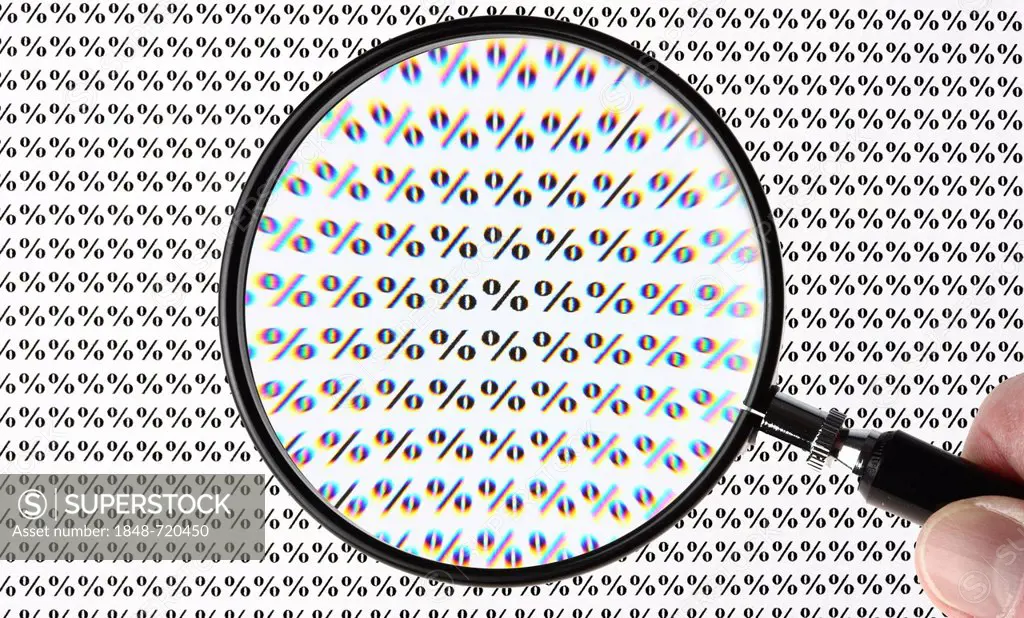 Percent symbol through a magnifying glass