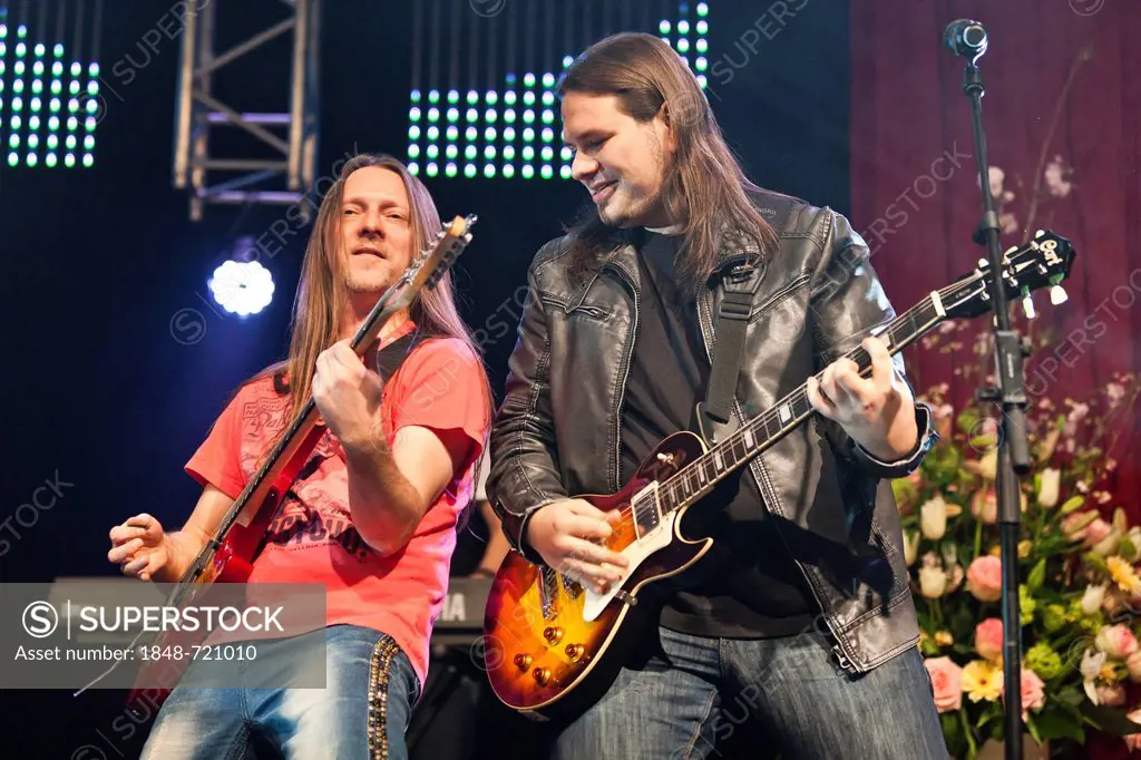 Andreas Marberger and Georg Daviotis of the Austrian pop and folk music group Schuerzenjaeger performing live at the Schlager Nacht 2012, pop music ev...