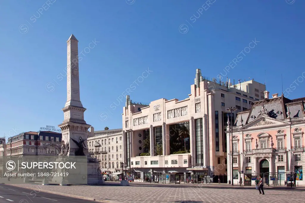 Obelisk on Praca dos Restauradores square with the former Eden Cinema, a cinema from the 30s Art Deco style, in the historic district of Rossio in Lis...
