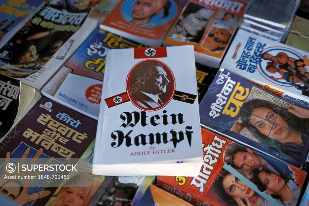 Adolf Hitler's Mein Kampf and Indian dime novels on sale at a book stall, railway station bookstore, Pune, Maharashtra, India, Asia