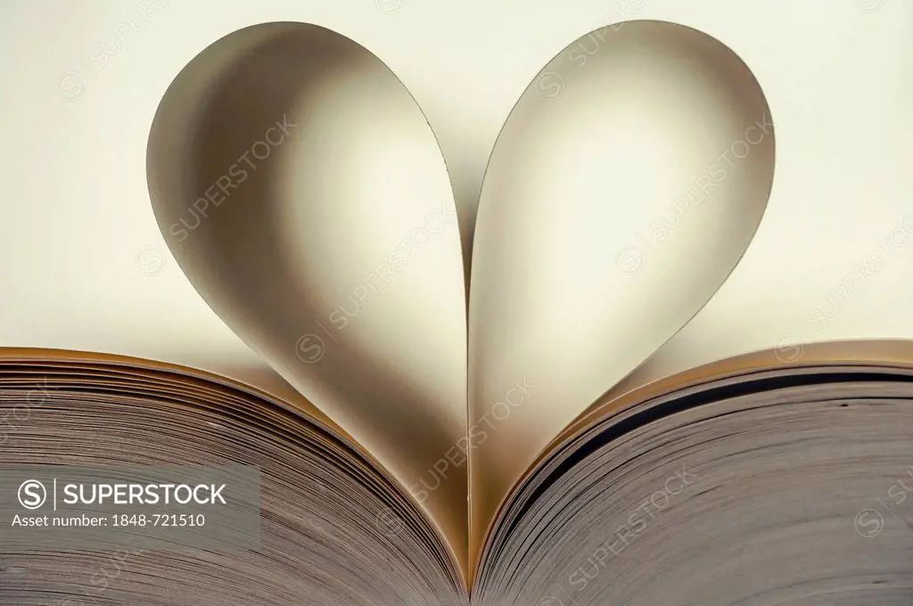 Open book with heart-shaped, curved, inner pages