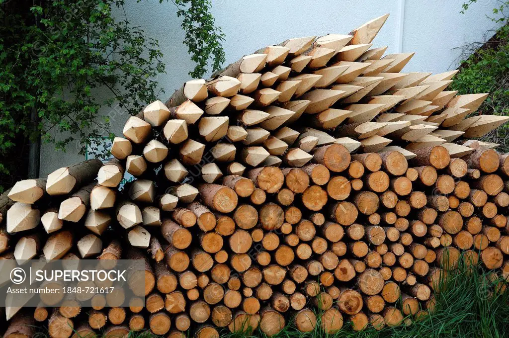 Stack of sharpened wooden stakes for fencing, Lillinghof, Middle Franconia, Bavaria, Germany, Europe