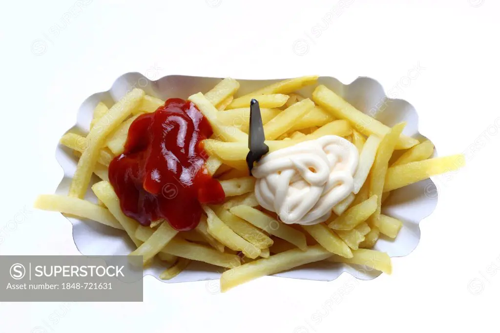 Fast food, French fries on a paper plate with ketchup and mayonnaise