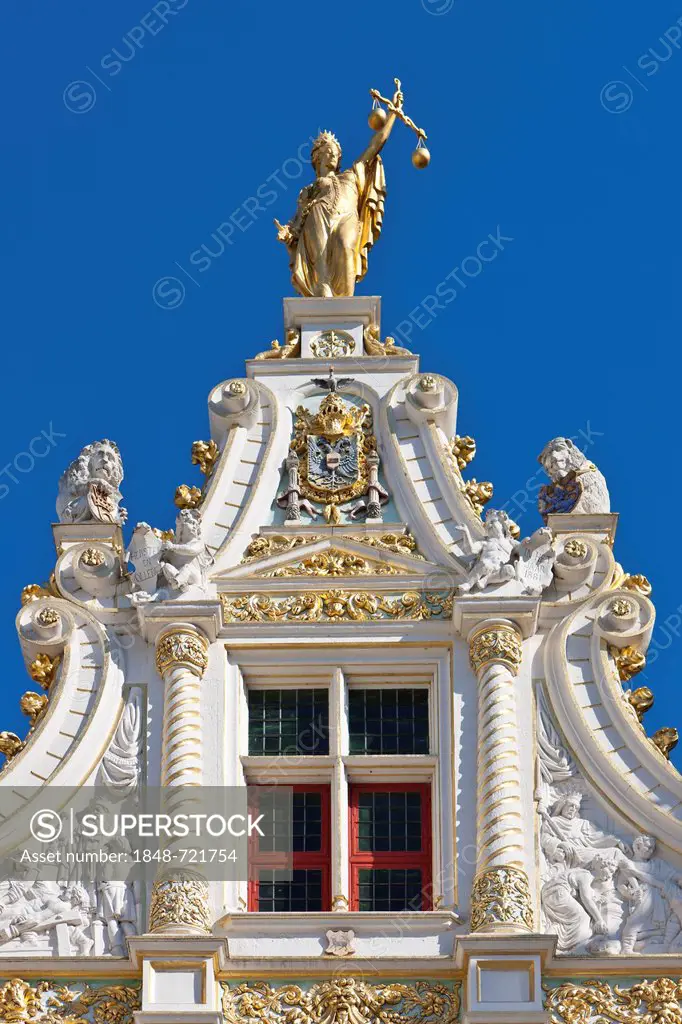 Statue of Justice on the gilded facade of Civiele Griffie, records office, old town of Bruges, UNESCO World Heritage Site, West Flanders, Flemish Regi...