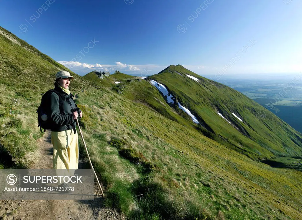 Hiker in the Massif du Sancy, Parc Naturel Regional des Volcans d'Auvergne, Regional Nature Park of the Volcanoes of Auvergne, Monts Dore, Puy de Dome...
