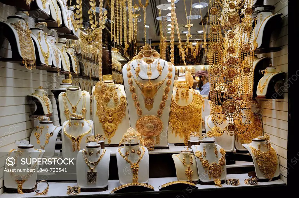Elaborate jewellery, mainly gold, in a window display in the Deira Gold Souk, Dubai, Emirates, Arabian Peninsula, Middle East, Asia