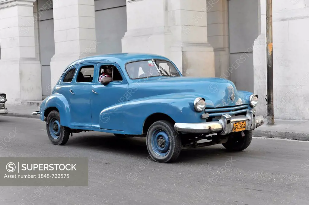 Blue 1950's vintage car in the Avenida Simon Bolivar, Calle Reina, town centre of Havana, Central Habana, Cuba, Greater Antilles, Caribbean, Central A...