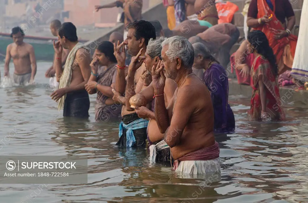 Pilgrims at the ghats of Varanasi in the busy morning hours, Uttar Pradesh, India, Asia