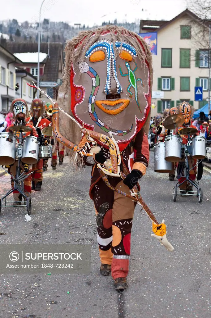 Guggen music band, drum major dressed up as indigenous Australian, Aborigine, 35th Motteri-Umzug parade in Malters, Lucerne, Switzerland, Europe