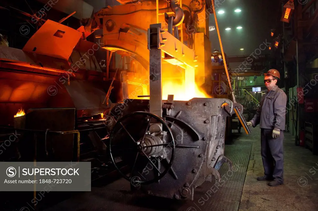 An employee of the Luitpoldhuette AG, a foundry that specializes in the casting of engine blocks, motor parts and refrigeration compressors, setting t...