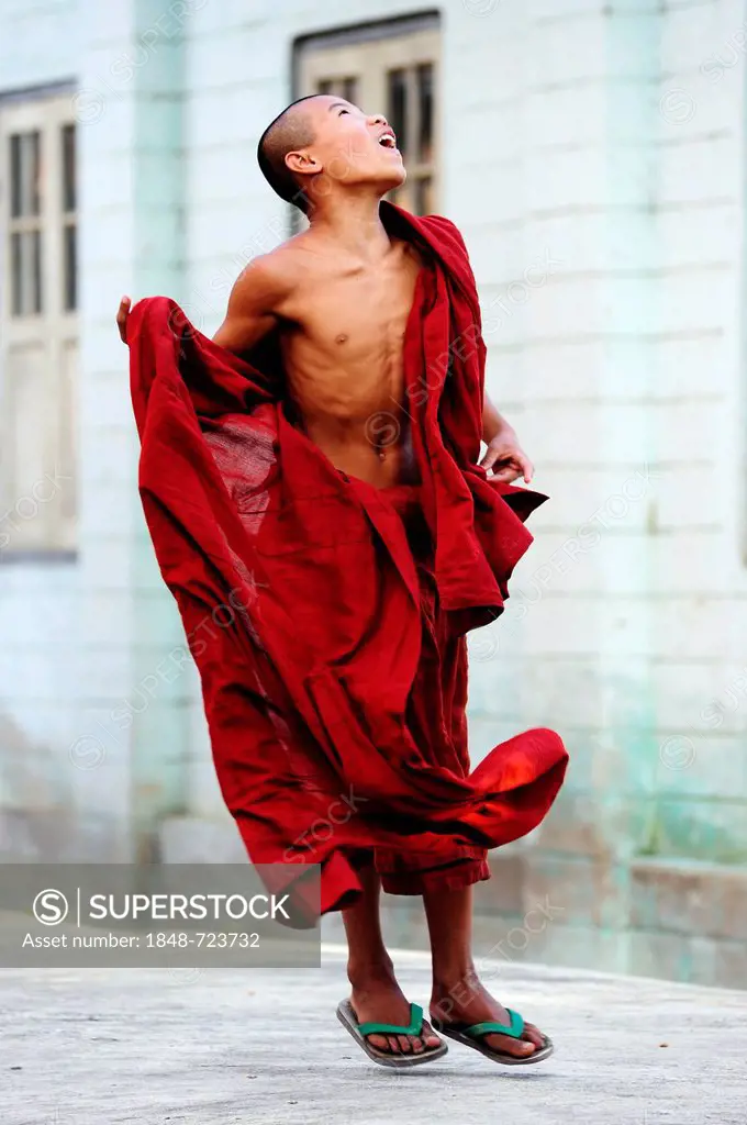 Novice jumping in a monastery, Myanmar, Burma, Southeast Asia, Asia