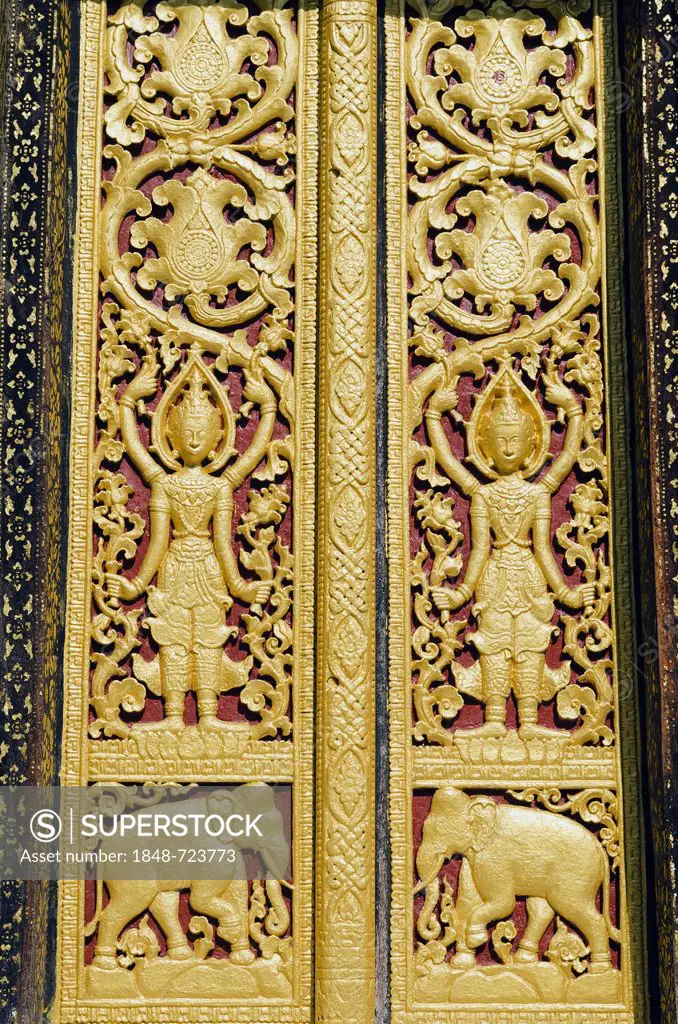 Entrance door ornamented with gold reliefs, Wat Xieng Thong temple, Luang Prabang, Laos, Indochina, Asia