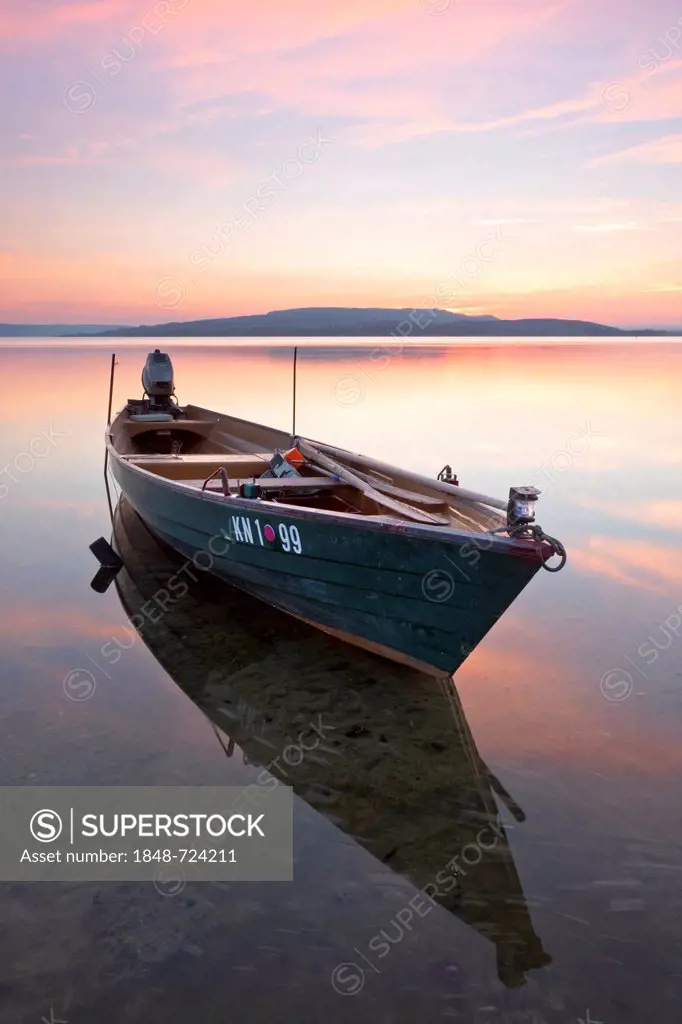 Fishing boat on a calm Lake Constance at dusk, Reichenau Island, Baden-Wuerttemberg, Germany, Europe, PublicGround