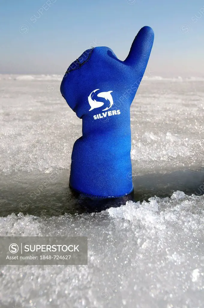 Diver's hand giving the Upwards sign, subglacial diving, ice diving, in the frozen Black Sea, a rare phenomenon, last time it occured in 1977, Odessa,...