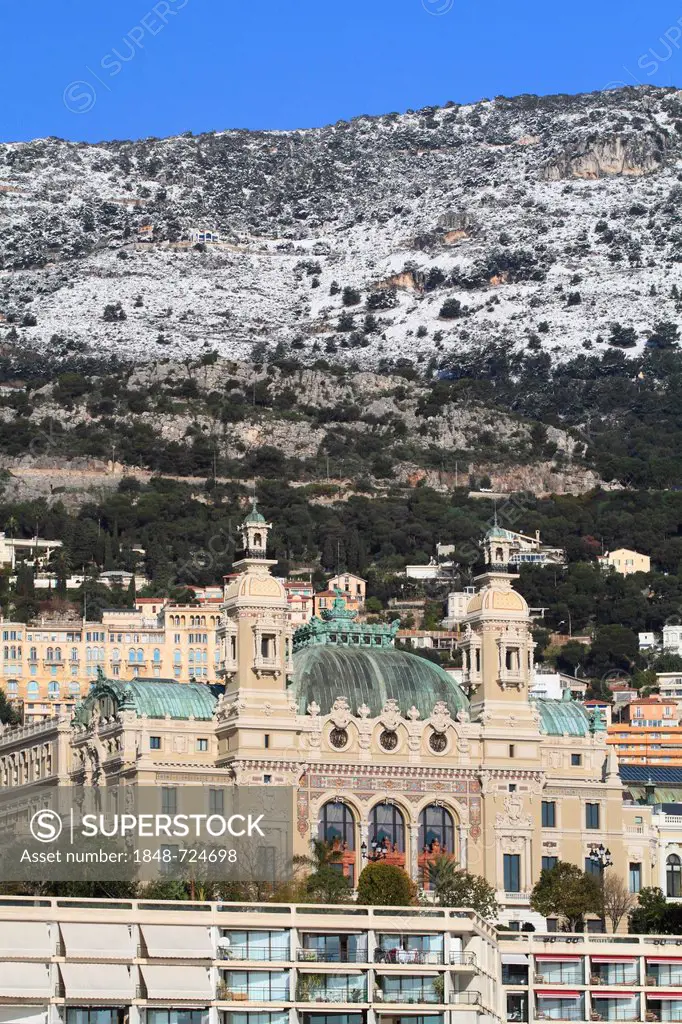 Monte Carlo Casino in winter with snow-covered mountains, Principality of Monaco, Côte d'Azur, Mediterranean Sea, Europe