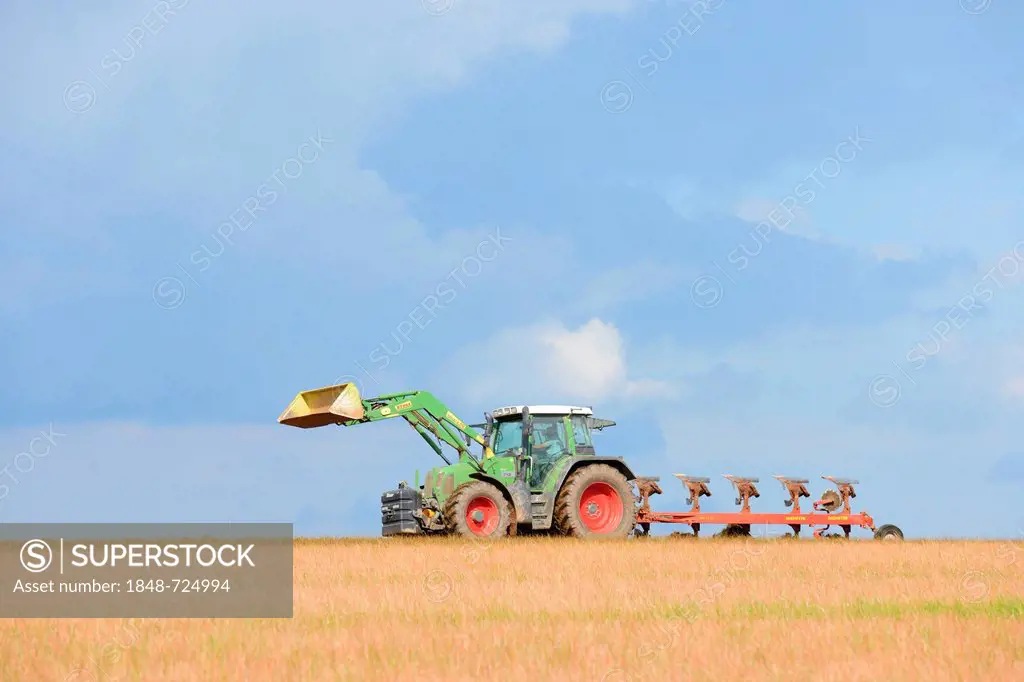 Farmers distributing manure over a corn stubble field, Baden-Wuerttemberg, Germany, Europe