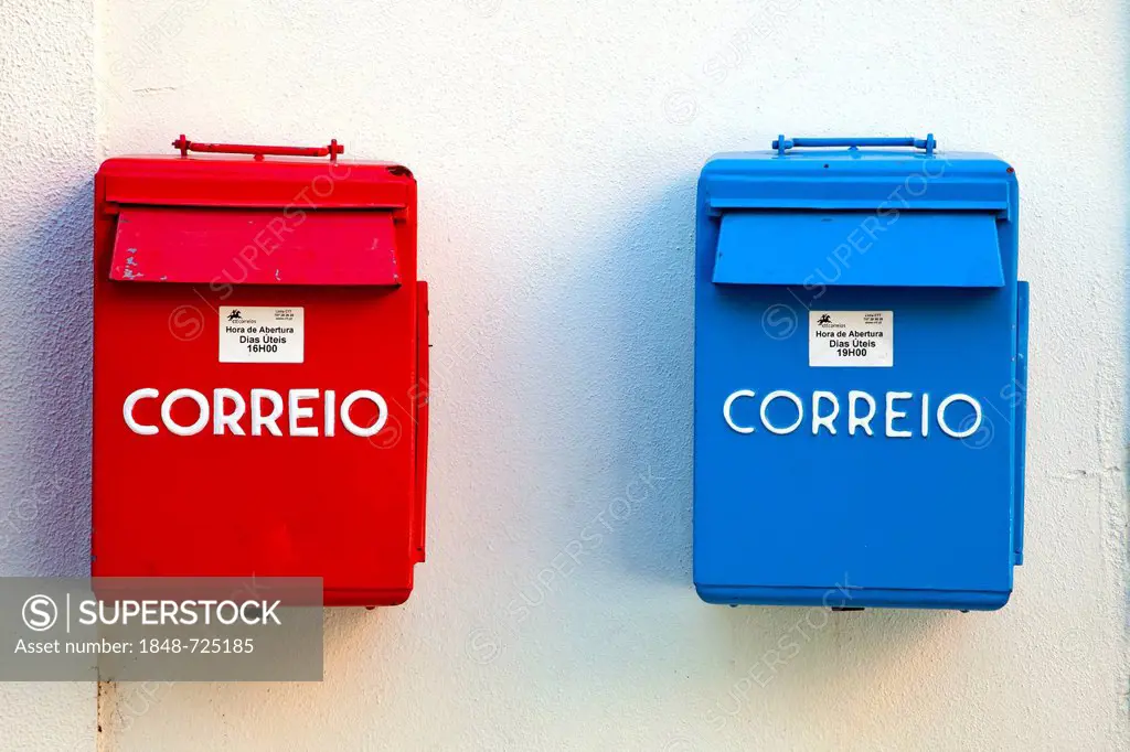Mailboxes of the Portuguese postal service, Correio, in red and blue for different collection times, in the district of Belem, Lisbon, Portugal, Europ...