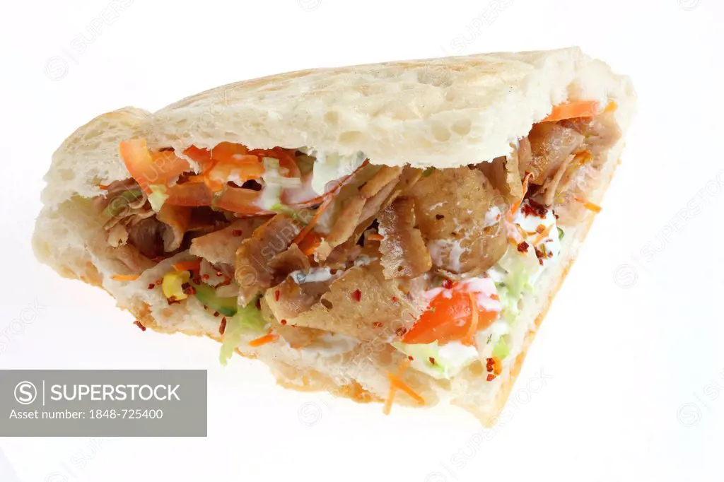 Fast food, doner kebab in pita bread with mixed salad and garlic-yogurt sauce