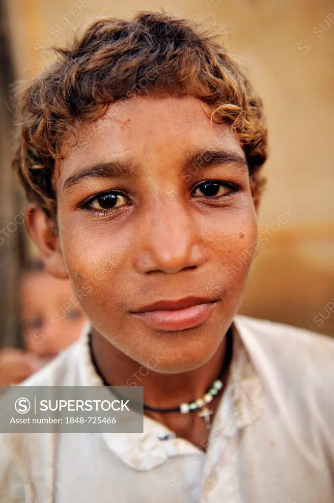 Portrait, Christian boy who works with his family under the slavery-like practice of debt bondage in a brick factory, Lahore, Pakistan, Asia