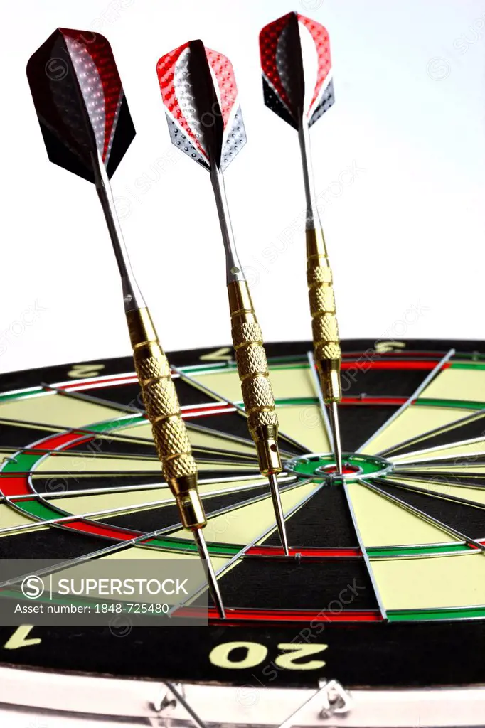 Darts, throwing game, darts sticking into the double and triple score grids and the middle of the dartboard, the bullseye